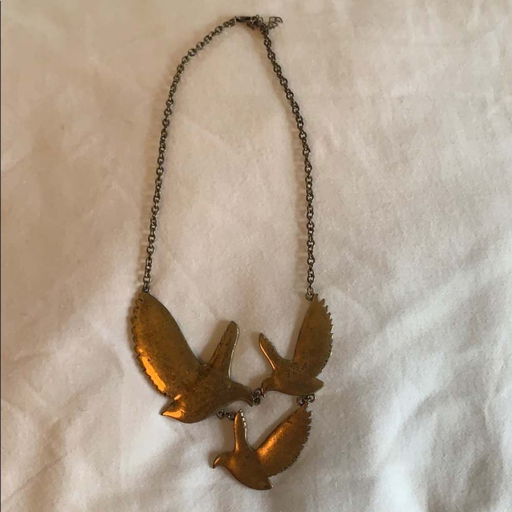 Three gold bird statement necklace